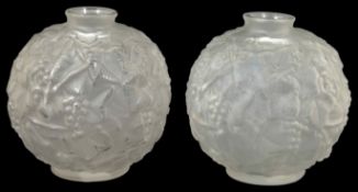 A pair of Sabino Art Deco frosted glass vases each of globular form with stylised leaf and berry