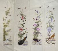 A Japanese embroidered four section panel circa 1900 each section embroidered in coloured silk floss