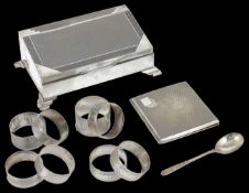 An Art Deco cigarette case hallmarked Chester, of slanting rectangular form, with engine turned