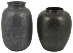 A Poole pottery vase of elongated ovoid form with matt glaze decorated with a random iridescent