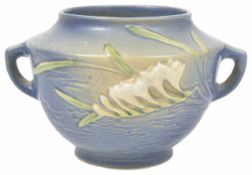 An interesting American Roseville twin handled vase of Art Noveau style decorated with stylised