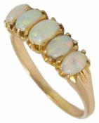 A five stone opal set half hoop ring the opals of good colour and in yellow metal mount, tests for