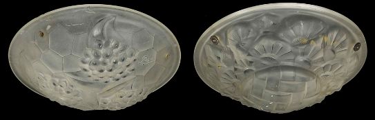 A pair of plaffioniers of circular form with mounded decoration of flowers and fruit Condition: Some