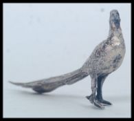 A SILVER MODEL OF A PHEASANT,