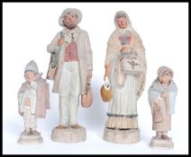 A fine group of German terracotta figures - country gypsy folk to include father  & mother with 2