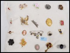 A collection of costume jewellery brooches to include cameo, celtic knot,