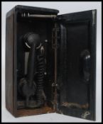 A vintage Railway trackside telephone, within the original cast iron cabinet case.