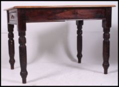 A Victorian 19th century country pine scrub top dining table raised on turned legs with fitted