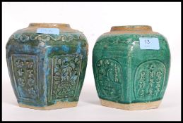 A pair of Chinese green glazed vases.