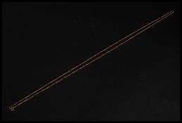 A long 18ct gold ladies serpentine chain linked necklace complete with clasp. Total weight 6.