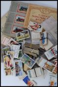 A collection of cigarette cards to include Sporting, Film, Radio, Dogs, Automobiles,