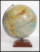 A vintage desk top globe of the world raised on a wooden squared base by Philips 10