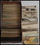 A collection of 700-800 old Great British view type postcards in shoebox. Appear cWWII era.