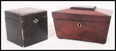 A Victorian mahogany small sarcophagus shaped tea caddy with hinged top together with a 1920's