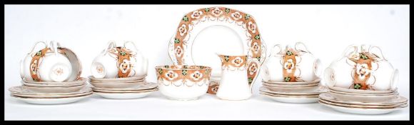 A Edwardian 12 setting Imari tea service by Royal Albert in the Heirloom pattern to include 12