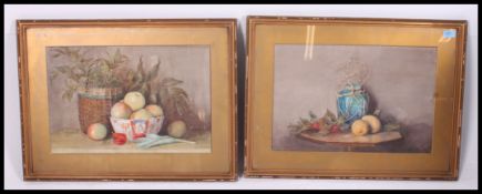 A pair of early 20th century watercolour still life paintings - fruits in bowl with vase etc both