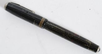 A 1936 Canadian silver / pearl striped Parker Vacumatic fountain pen with Parker arrow head nib.