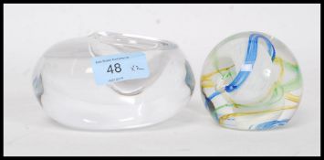 A Caithness ' Ribbons ' paperweight signed to the base along with another paperweight again signed