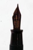 A 1936  Canadian striped gold Parker Vacumatic fountain pen with arrow parker nib.