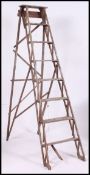 A vintage mid 20th century wooden step ladder.
