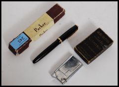 A Parker Duofold vintage fountain pen with 14ct nib having black body with gold trim in packaging.