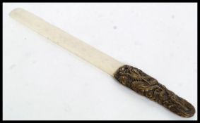 A 19th century Japanese bronze and ivory page turner,