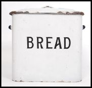 A vintage enamel bread bin, with lid, marked ' Bread ' to front.