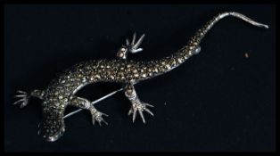 A 20th century ladies sterling silver and marcasite lizard brooch.
