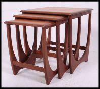 A G-Plan style Kelso nest of teak Danish tables. Each with shaped supports and graduating tops.