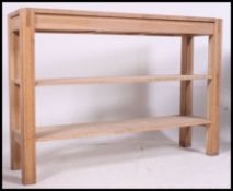 A good quality solid oak console table in the form of a workbench.