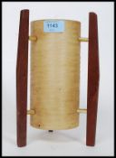 A vintage 1960's teak and fibre glass table top rocket lamp.