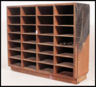 A 20th century Industrial pigeon hole - stationary cabinet having multiple sections ( see