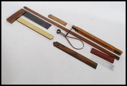 A collection of vintage measures to include slide rules,