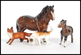 A collection of Beswick figurines to include fox, hound, horse and a Shetland pony.