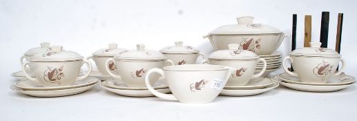 A 1930's Poole part dinner service having Acorn and Oak leaf design, Ruth Pavely mark to base,