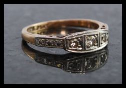 A ladies 9ct gold and platinum 3 stone diamond ring.