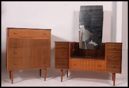 A mid 20th century retro matching part bedroom suite consisting of a straight four chest of drawers,