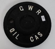 A GWR cast Iron cover for a fuel tap with the words GWR OIL GAS,
