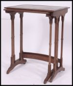 A set of two graduating nest of oak tables.