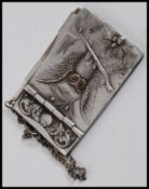A charming small pewter aide de memoir notepad of elegant form, decorated with an owl to the front.