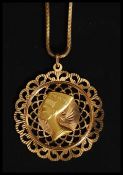 An 18ct / 750 marked snake linked necklace and pendant.