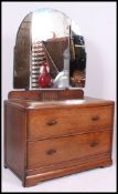 An early 20th century 1930s dressing table having two straight drawers and a three piece mirrror to