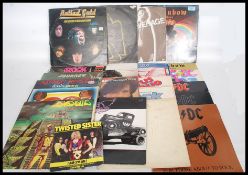 A collection of long play vinyl records of mainly rock artists to include AC / DC x 6 Rainbow x 2,