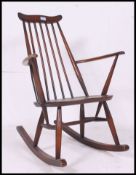 A vintage Ercol beech and elm Windsor rocking chair - armchair.