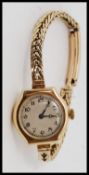 An early 20th century 15ct gold Rolex ladies cocktail / dress watch set to a 9ct gold snake linked