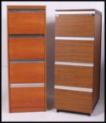 A near pair of retro 1960's / 1970's four drawer filing cabinets with a teak finish.
