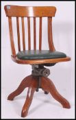 A 1920's Industrial solid oak swivel - clerks desk chair.