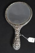An Edwardian heavy silver hallmarked rococo cherub,