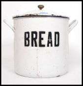 A vintage early 20th century enamel  round bread bin, with lid, marked ' Bread ' to front. H34cm .