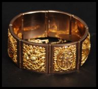 A Chinese gold bracelet bearing Chinese makers marks with English Assay office 375 / 9ct gold